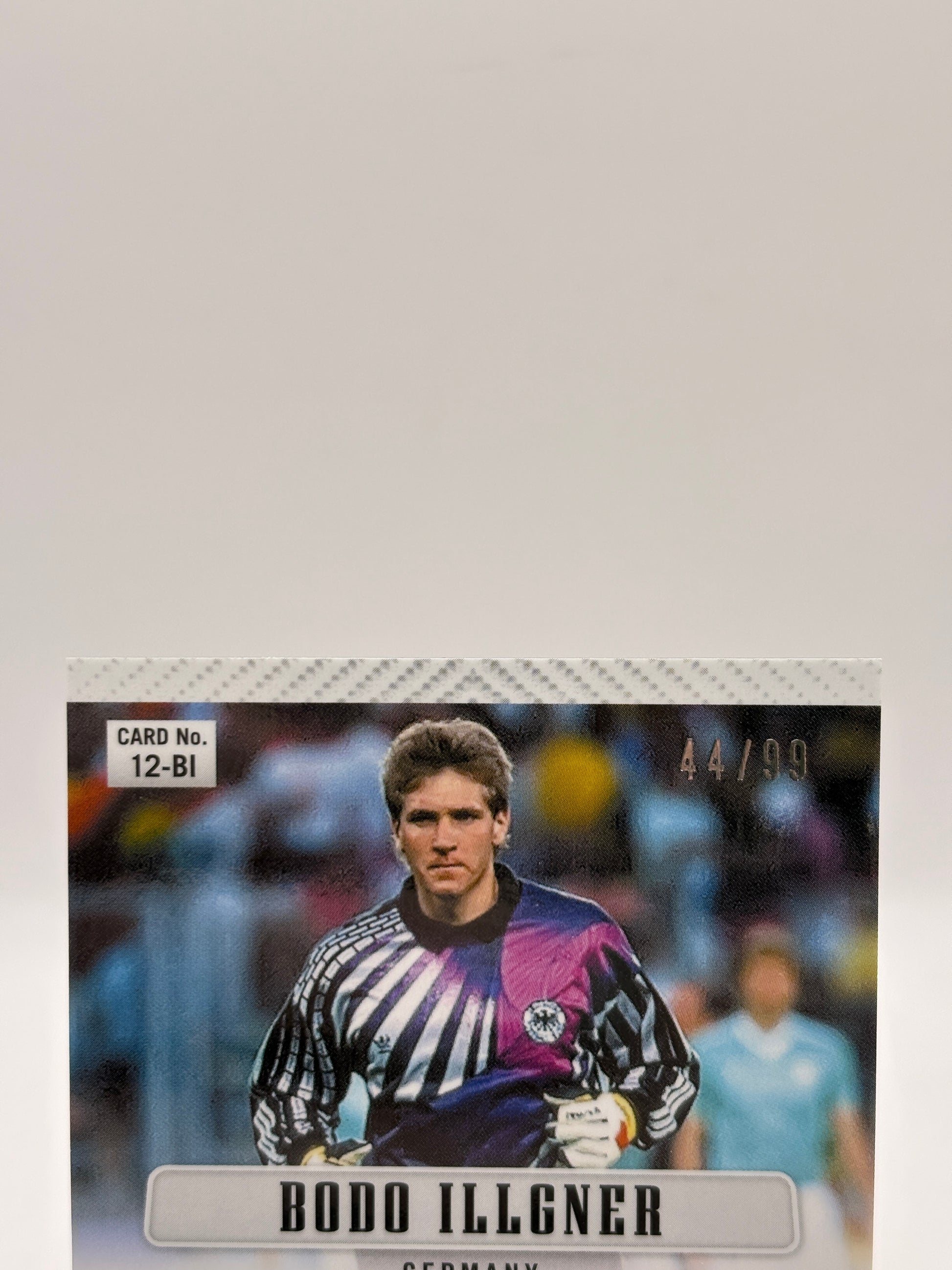 2026 Panini Fifa World Cup 2026 - #12-BI Bodo Illgner Auto Red 44/99